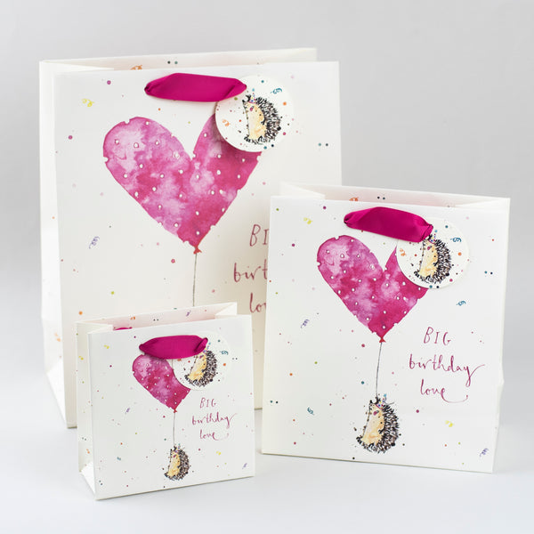 Image of illustrated birthday hedgehog holding a heart shaped balloon gift bags with the caption BIG Birthday Love