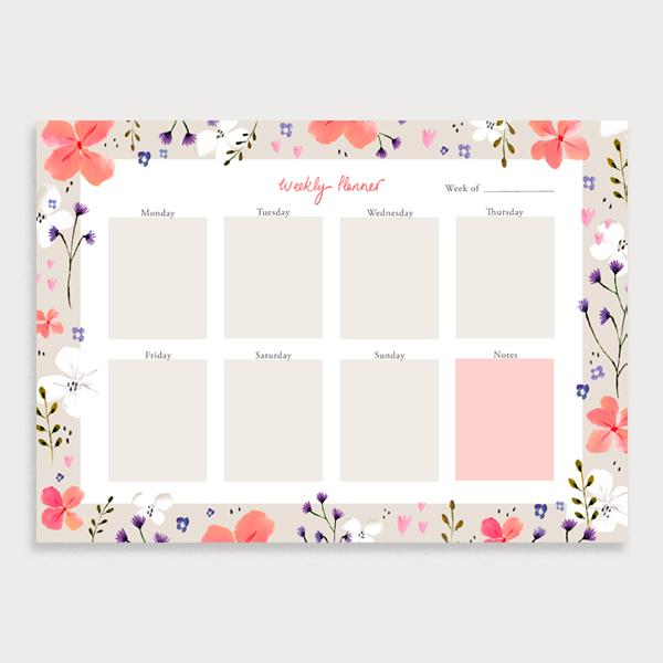 Image of illustrated weekly planner pad with a coral coloured floral border. It has a title of Weekly Planner and has seperate boxes for the days of the week and a note section