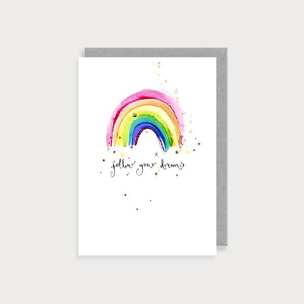 Image of illustrated card with a rainbow and the caption follow your dreams