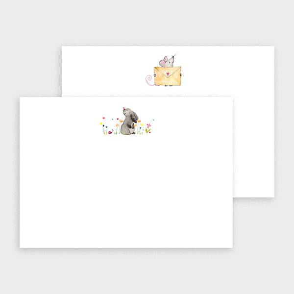 Image of illustrated notecard set with one bunny and flower design and a separate mouse holding an envelope design