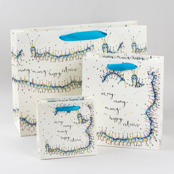 Image of illustrated 3 centipede birthday gift bags with the caption Many Many Happy Returns