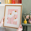 Image of illustrated daisies in a frame