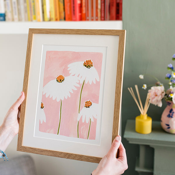 Image of illustrated daisies in a frame