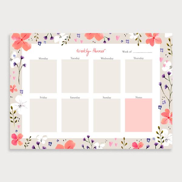 Image of illustrated weekly planner pad with a coral coloured floral border. It has a title of Weekly Planner and has seperate boxes for the days of the week and a note section