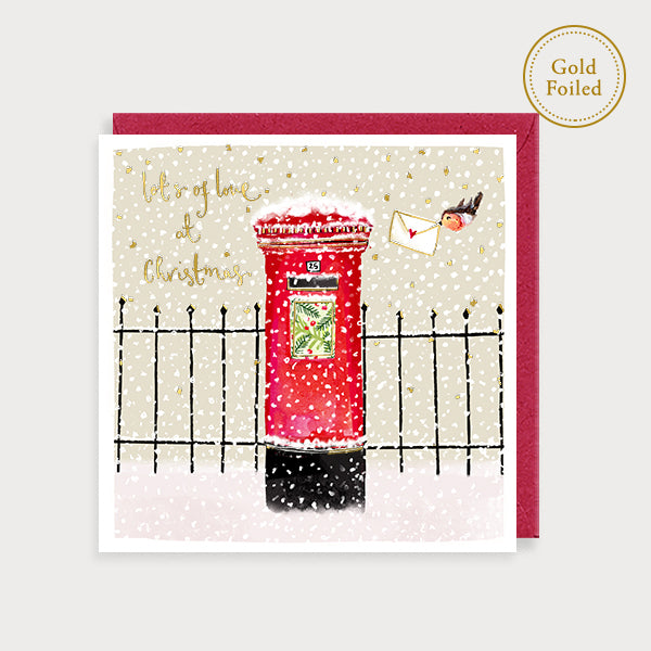 Image of illustrated christmas card with a post box in the snow and the caption lots of love at christmas