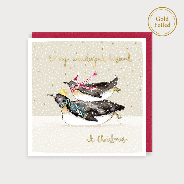 Image of illustrated foiled christmas card with two penguins and the caption to my wonderful husband at christmas