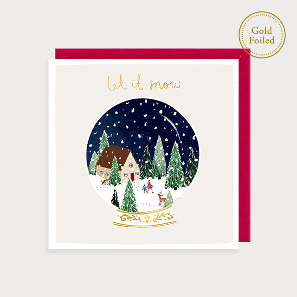 Image of illustrated foiled christmas card with a snow globe with a snowy scene in it and the caption let it snow