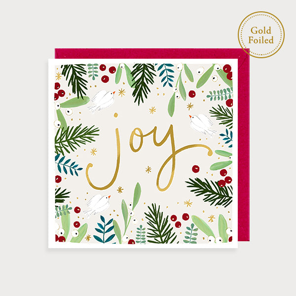 Image of illustrated foiled christmas card with a foliage border and the caption joy